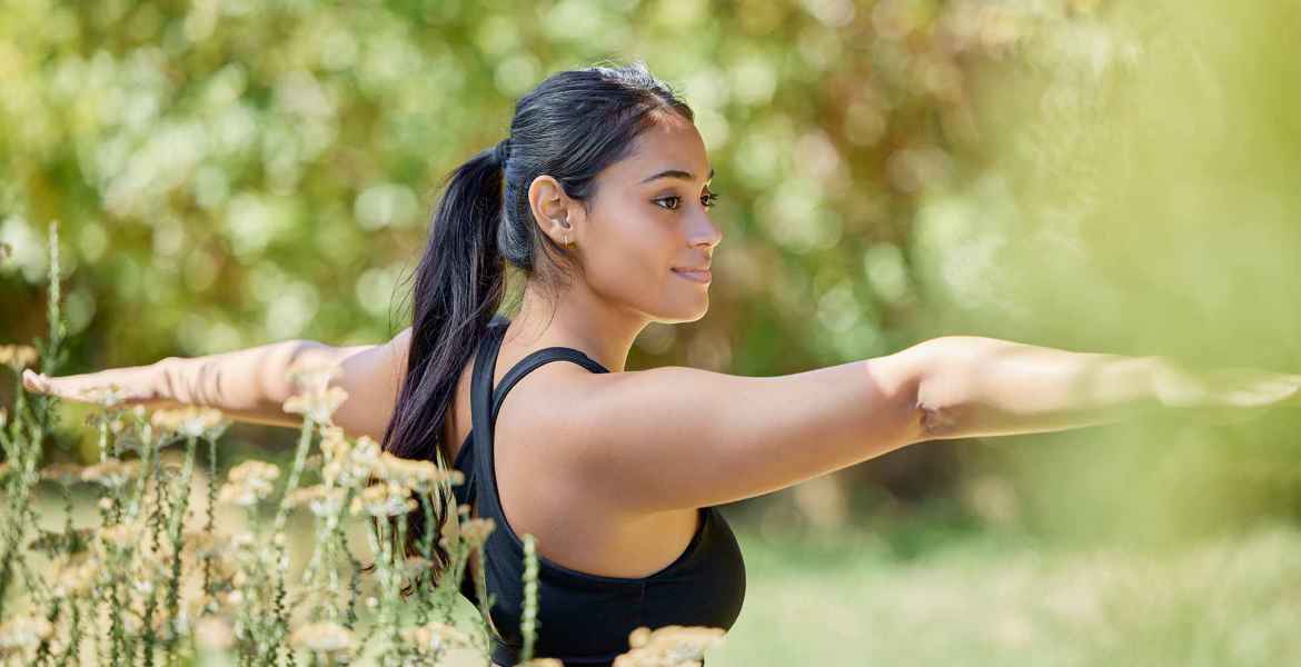 balance-stretching-and-yoga-by-woman-in-nature-fo-2023-03-08-18-54-48-utc