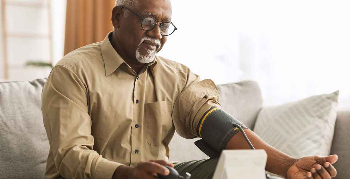 man measuring arterial blood pressure