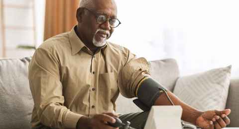 man measuring arterial blood pressure