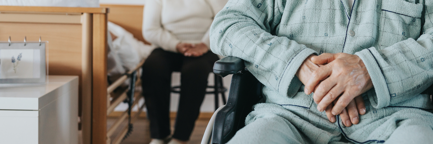 senior man after stroke sits in a wheelchair at a nursing home