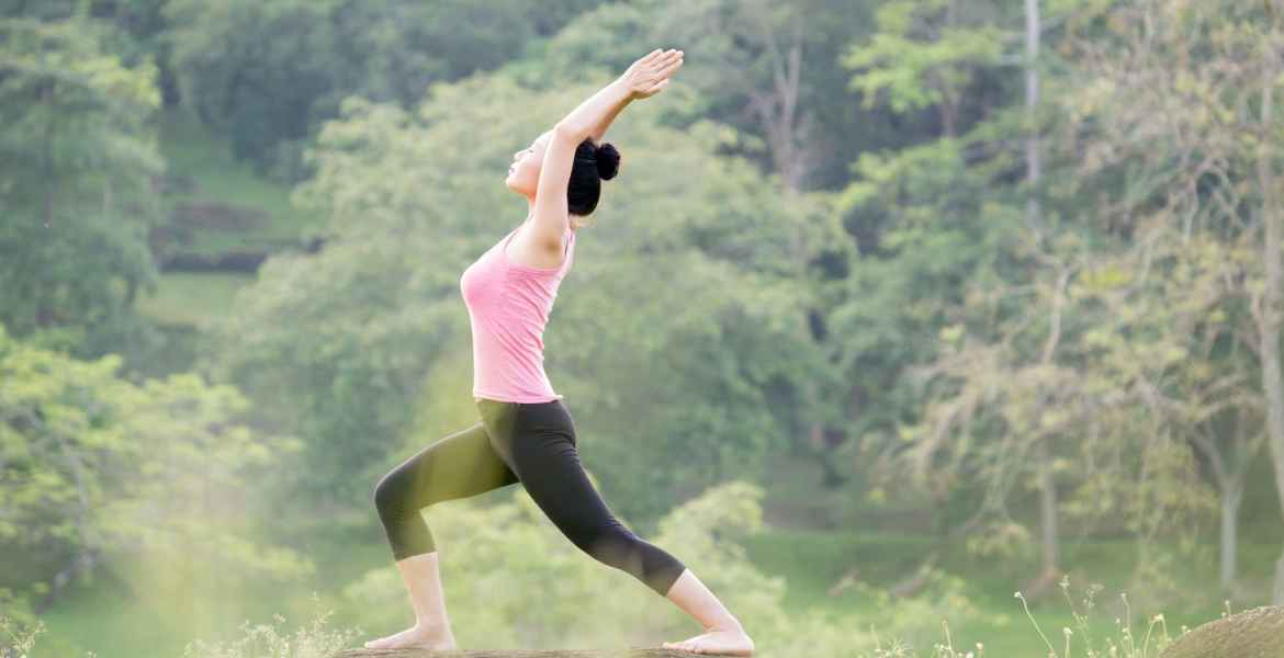 young asian woman practicing yoga