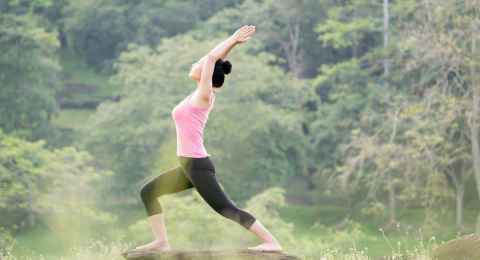 young asian woman practicing yoga