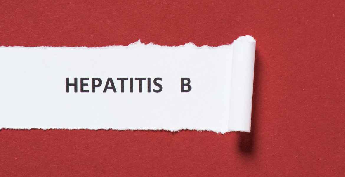 top view of lettering hepatitis b on paper on red background, world hepatitis day concept