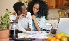 people, relationships, financial stress and economic crisis concept. young bankrupt african male telling his unhappy wife that he is no longer able to cover family expenses because of no money