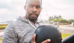 athletic man doing exercise with medicine ball.