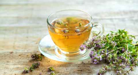 thyme tea in a cup. selective focus.